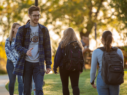 Students walking on a Penn State campus in fall