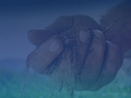 hand holding dirt with blue overlayåç