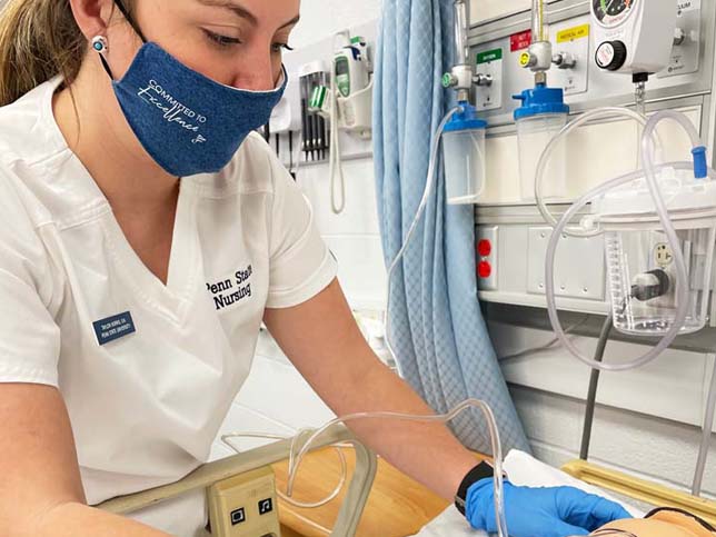 A Mont Alto student in the nursing program provides a breathing treatment on a simulated patient.