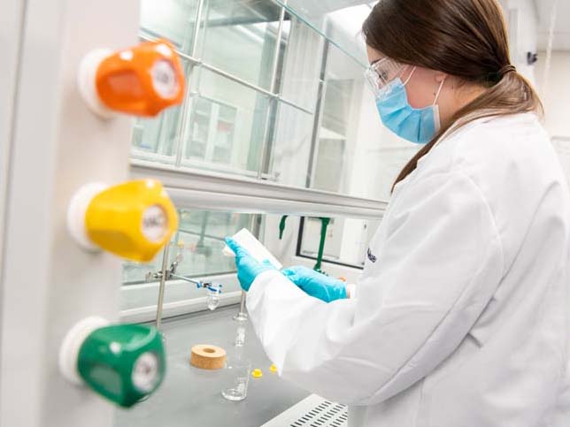 A student works on an experiment under a hood in Penn State Schuylkill’s organic chemistry lab.