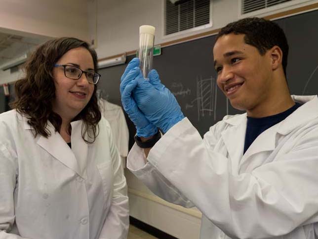 Faculty member and student examine specimen in a biology lab on the Penn State York campus.