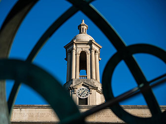 Old Main bell tower seen through armillary sphere sculpture